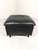 Black leather square hocker / footstool by Franz-Josef Schulte for de Sede, Switzerland (marked). This older edition still...