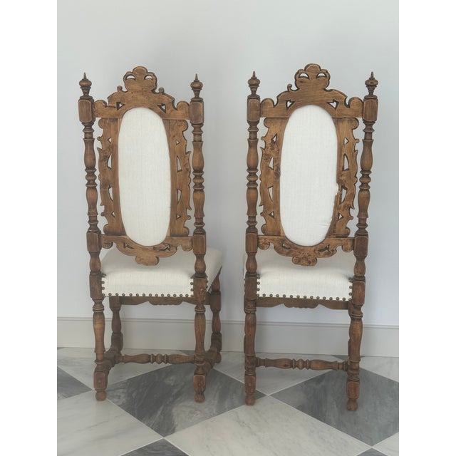Pair of ornate vintage Borroque style,high back chairs.Carved wood frames ,turned legs & creamy color upholsterer with...