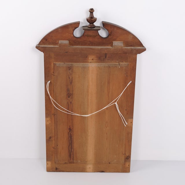 Antique mirror crafted in mahogany dating from around 1910. It features a classic appearance with a simple frame...