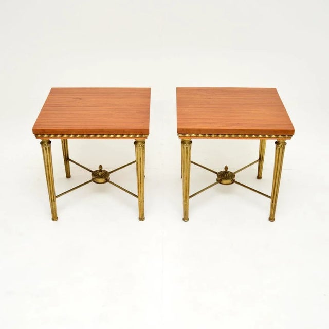 A superb pair of antique satin wood and brass side tables, made in England and dating from around the 1920’s. They are of...