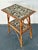 This one-of-a-kind vintage side table is a masterful example of "Pique Assiette" mosaic artistry, blending bohemian charm...