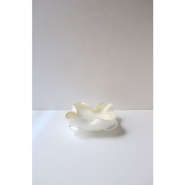 A beautiful Italian Murano transparent, white, and gold art glass bowl, Midcentury Modern design period, attributed to...