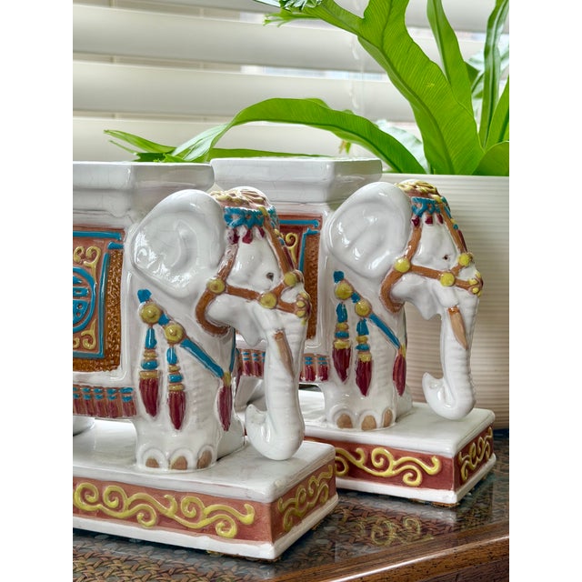 Petite pair of vintage tabletop Asian elephant figurines, each measuring approximately 6.25” w x 2.75” d x 6.25” high....