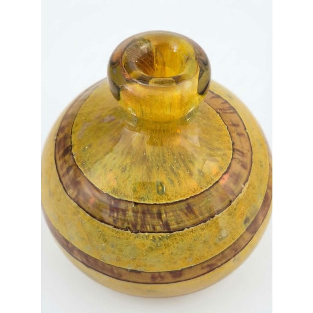 A charming little spherical vase in hand-blown glass, produced by Mdina Glass, founded in Malta in 1968 by British master...