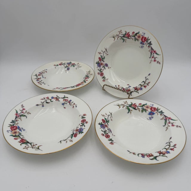 Wedgwoods Devon Sprays is a graceful dinnerware pattern accented with blue & pink flowers, long stems, and leaves. With...