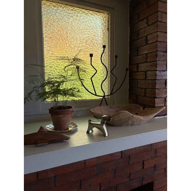 Bring a touch of Art Deco-inspired elegance to your space with this polished aluminum dog sculpture. Featuring bold...
