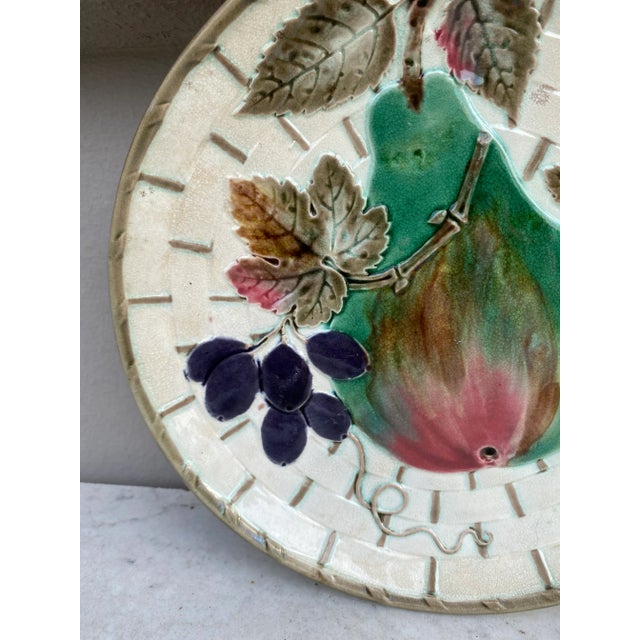 19th century Victorian Majolica Argenta ware dessert plate decorated with a pear,gooseberries and plums signed Wedgwood.