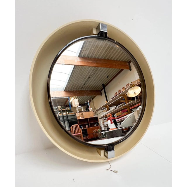A favorite among true vintage enthusiasts! cream-colored plastic designer mirror with a diffused backlight by specchio...