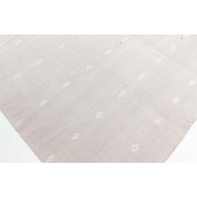 Vintage Indian Dhurrie rug Size: 10'0" × 15'4" (304 × 467 cm). This vintage Indian Dhurrie rug exemplifies quiet elegance...