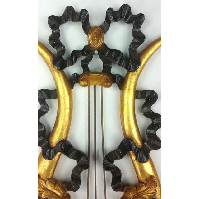 Vintage pair of French Giltwood Wall Sconces. Hand carved from solid wood with 2toned finishing.