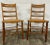 This is a stunning pair of vintage Colonial style Ladderback dining chairs with caned seats. They feature beautifully...