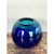 This vintage glass sphere vase presents a bold, orb-like form with a compact, gently narrowed opening at the top, creating...