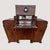 An exceptional 1920s Art Deco bar cabinet showcasing the elegance and craftsmanship of the Jazz Age. Crafted from richly...