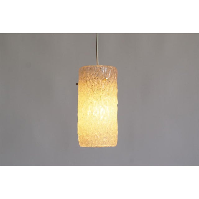 Add a touch of timeless elegance to your space with these petite ‘Riffle’ pendant lamps by Kalmar, Austria. Featuring...