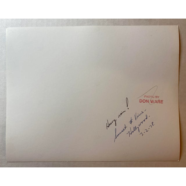 1978 black & white photograph of a heavy rainstorm in Los Angeles. Titled, dated and bearing Ware's studio stamp on the back.