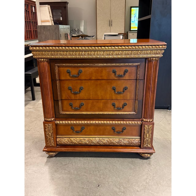 Design Plus Gallery presents the Pulaski Furniture Bachelor’s Chest. This chest has a polished wood exterior accented by...