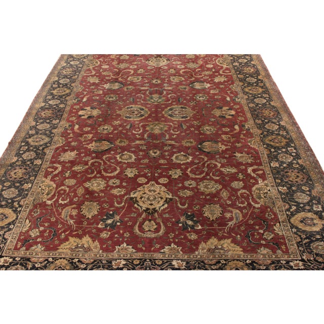 An 8x12 antique Hereke style rug originating circa 1920-1930, showcasing a fine blend of impeccable textural sensibilities...
