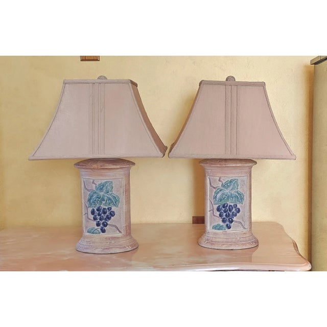 Gorgeous pair of American made Hollywood Regency sienna table lamps featuring grapes with ball shaped finials in excellent...