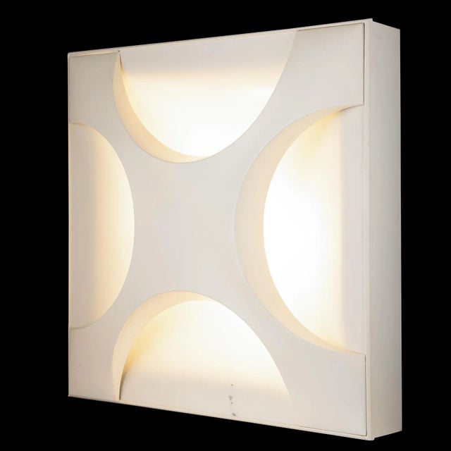 An unusual, square wall light or ceiling light is on offer, for which the designer rolf krüger received several design...