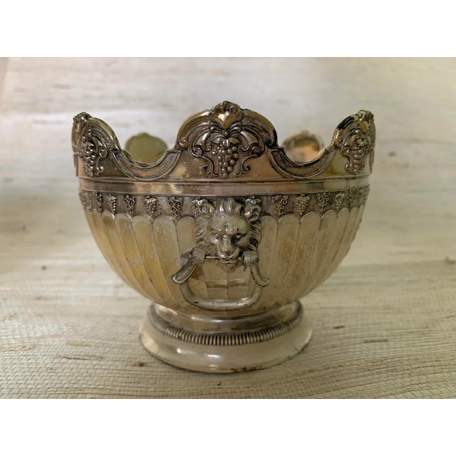 Beautiful vintage metal bowl with lion head handles.