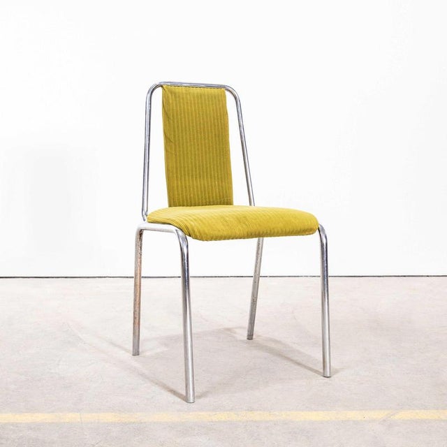 : 1980’s Olive Green Upholstered Chrome Framed Stacking Dining Chairs – Set Of Eight. Produced in the late eighties by...