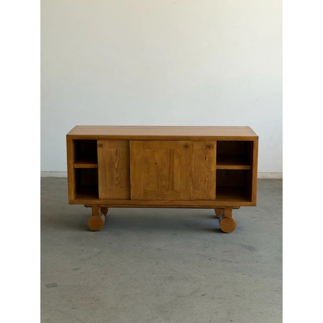 W60 D18 H32 Trolley Credenza made in house in solid Pine. Item has three sliding doors and two thick removable shelves....