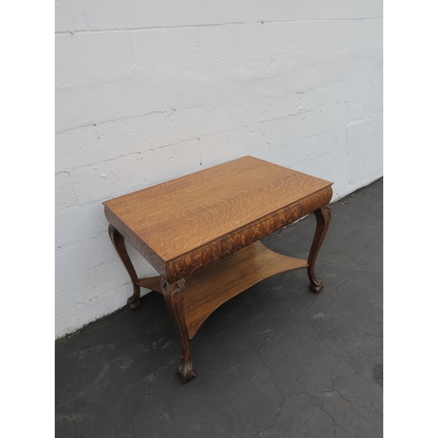 This great Table is made of wood, solid wood, oak, tiger oak, and veneer. This desk is an excellent example of Traditional...