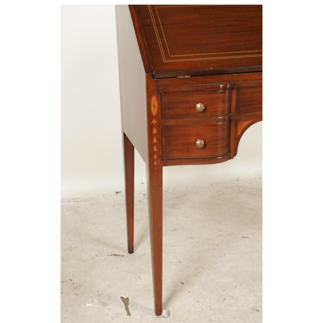 A Sheraton-Style Mahogany Desk contemporary, with nice inlay work.. No manufacturer's label Dimensions: 39 x 37 1/2 x 19...