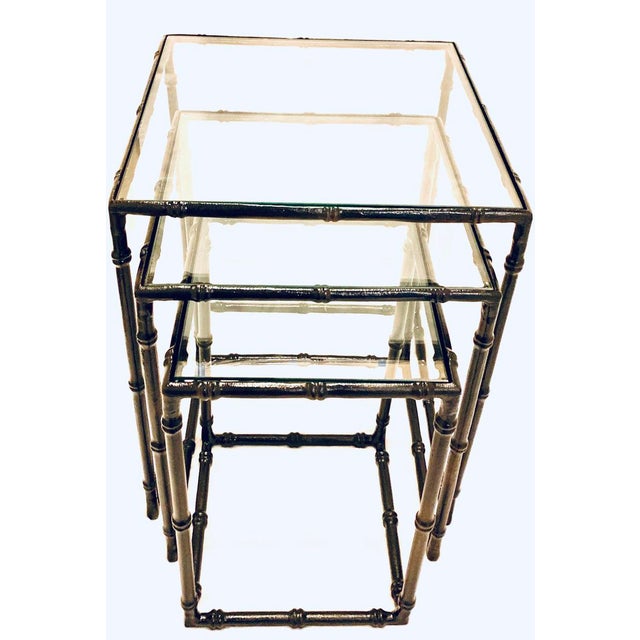 This set of Mid-Century Modern Faux Bamboo Nesting Tables are perfect for anyone trying to add some character into a...