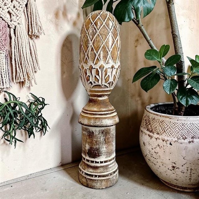 Elevate your home decor with our White Washed Carved Wooden Finial Shelf Decor, featuring an intricately designed...