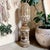 Elevate your home decor with our White Washed Carved Wooden Finial Shelf Decor, featuring an intricately designed...