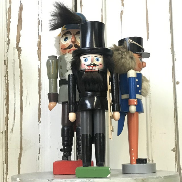 Celebrate tradition with this set of three vintage nutcrackers—each piece showcasing timeless craftsmanship and charm,...