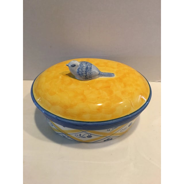 Cheerful hand painted blue & yellow covered casserole from Bernarda of Portugal. Bluebird for handle, criss-cross, and...