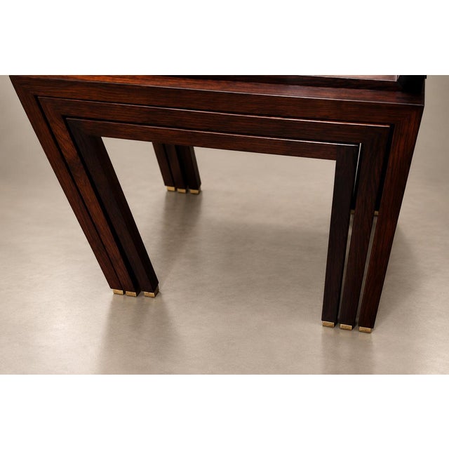 A set of three Brazilian nesting tables from the 1960s, made with solid jacaranda rosewood frames. Each has a rectangular...