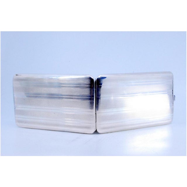 Silver Cigarette Case with Guilloche Bands, in Very Good conditions. Designed 1890 to 1919 This piece has an attribution...