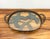 A charming vintage serving tray featuring an oval glass surface showcasing a pair of stylized crossed palm trees beneath...