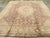 An antique Turkish Oushak room size carpet. A stepped ivory cartouche-form medallion is set on a soft medium brownfield...