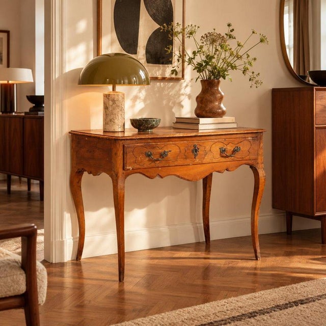 Barocchetto walnut console crafted in Parma in the 18th century. The serpentine front is enhanced by a drawer in the...