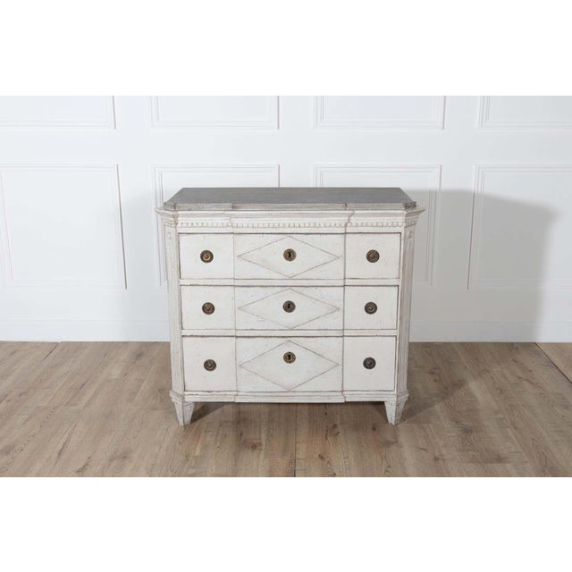 A beautifully detailed Swedish chest of drawers in the Gustavian style, dating to circa 1880. This elegant piece is...