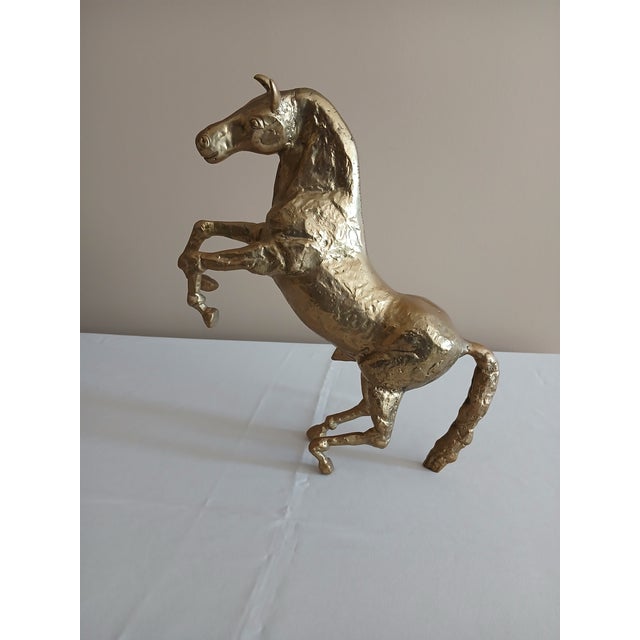 Majestic solid brass horse in a rearing position. Nice condition. Dimensions: 14” High 12 ¼” Long 3 ½” Deep