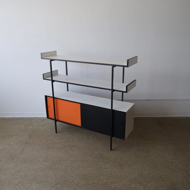 c. 1970s in great vintage condition. This piece works great as a cabinet or as a room divider - both sides feature sliding...