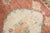 An early 20th-century Turkish Rug featuring 2 large pigeons on an apricot field Size 9' 5" x 11' 5" (287 x 348 cm).