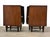 A pair of mid century modern mahogany two drawer nightstands with sculpted pulls. 20” wide. 17.25” deep. 26.25” tall.