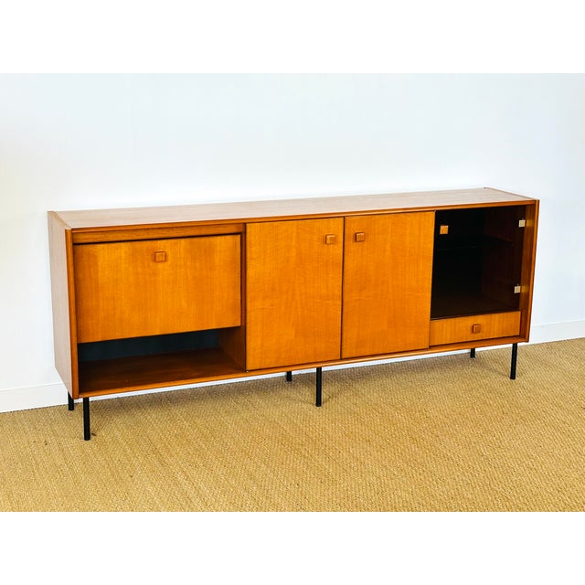 Stunning vintage Scandinavian teak sideboard with a simple yet elegant design from the 1960s. Its clean lines, discreet...