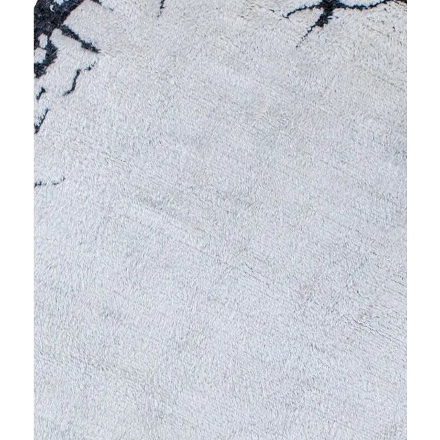 Beautiful hand knotted modern rug. Made of 75% wool and 25% cotton with very modern design and colors, this extremely...