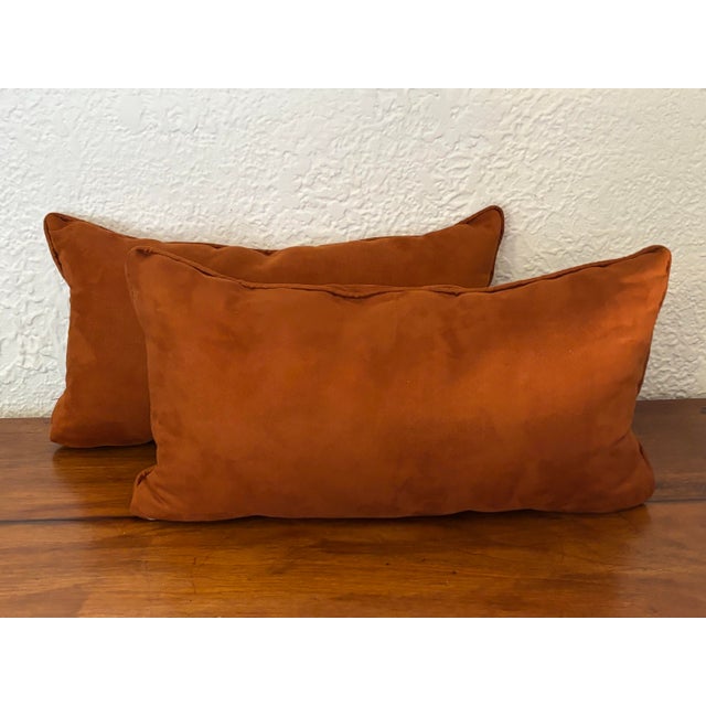 Vintage pair of burnt orange suede-like throw pillows. Feature matching cording and a light gray zipper that allows for...