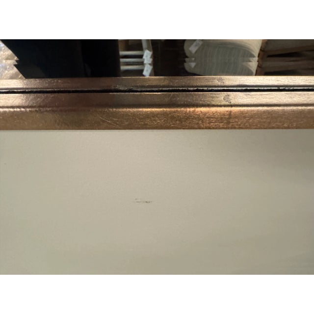 Hand welded polished stainless steel mirror finished in brushed brass. Beveled center mirror. Cleat hardware provided....