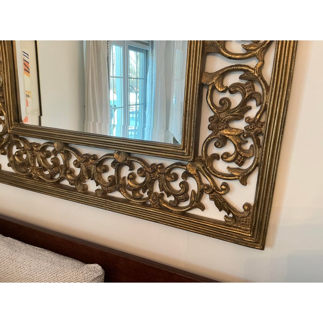 hand carved wood wall mirror a beautiful accent piece.