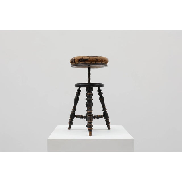 France / 1920 / piano stool / wood, metal, fabric / Art Deco French piano stool with black lacquered turned base and...
