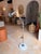 This contemporary industrial-style adjustable floor/table lamp combines sleek functionality with refined materials....